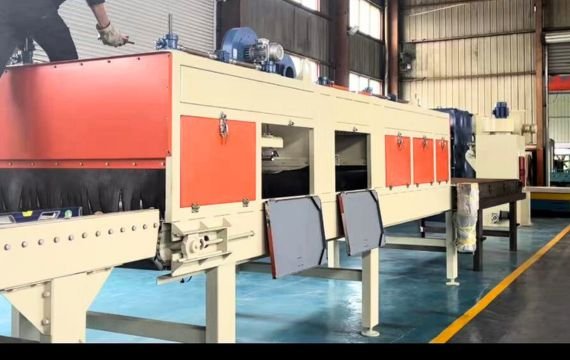 Coating machine for paver blocks